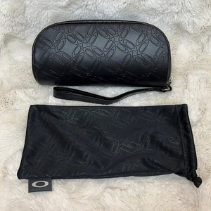 Oakley sunglasses case and‎ dust bag.